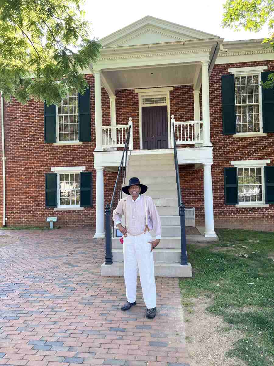 Man standing in front of brick building
