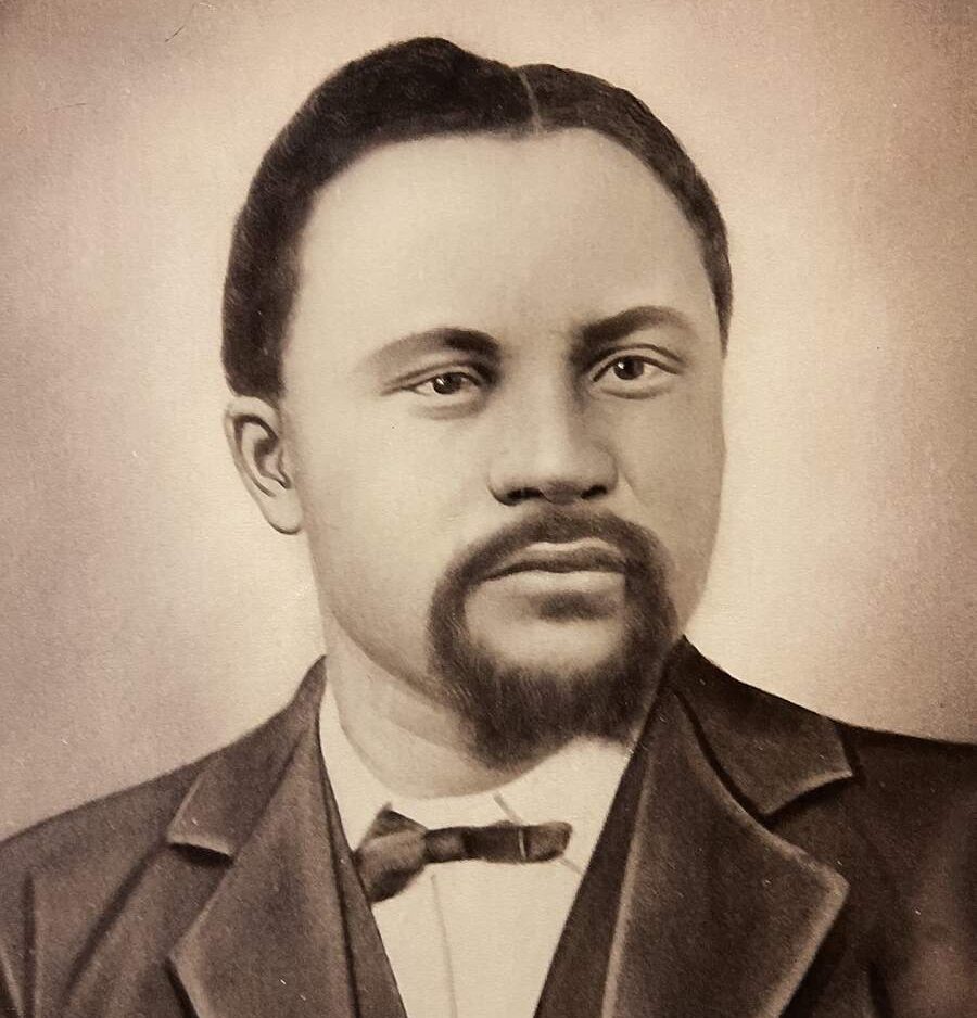 man with mustache and beard in suit and tie