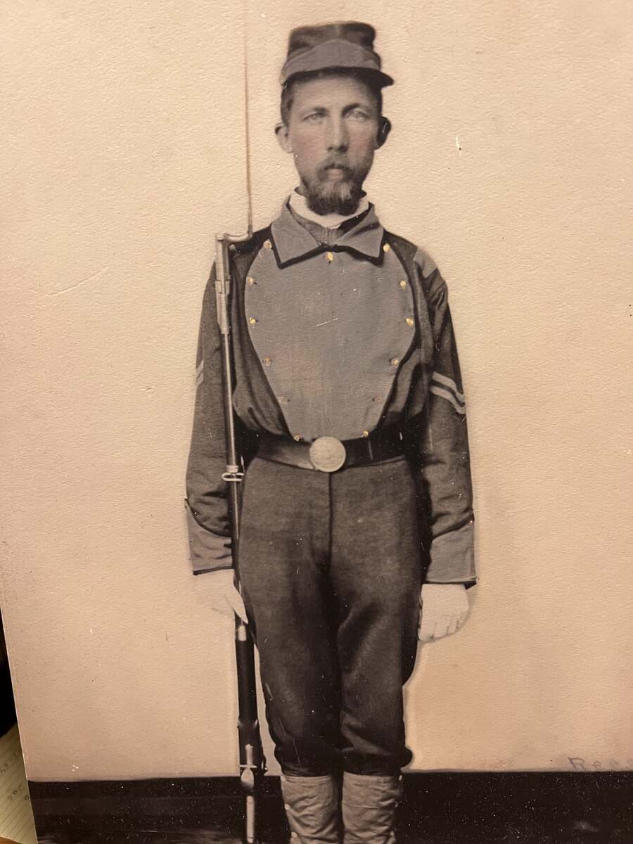 Man with mustache and beard in Confederate army uniform